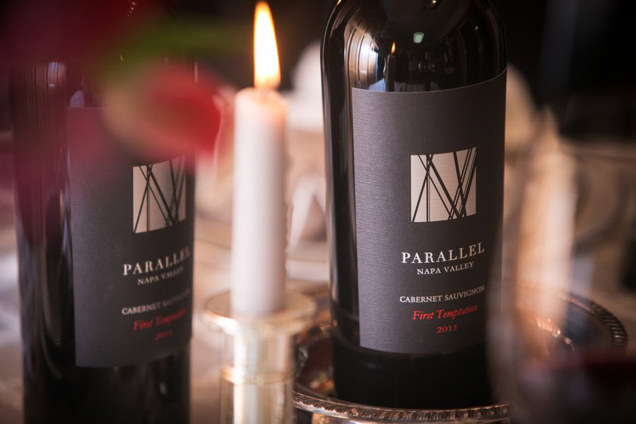 Parallel Wines Cabernet Sauvignon bottle with candlelight, emphasizing wine branding and elegant presentation.